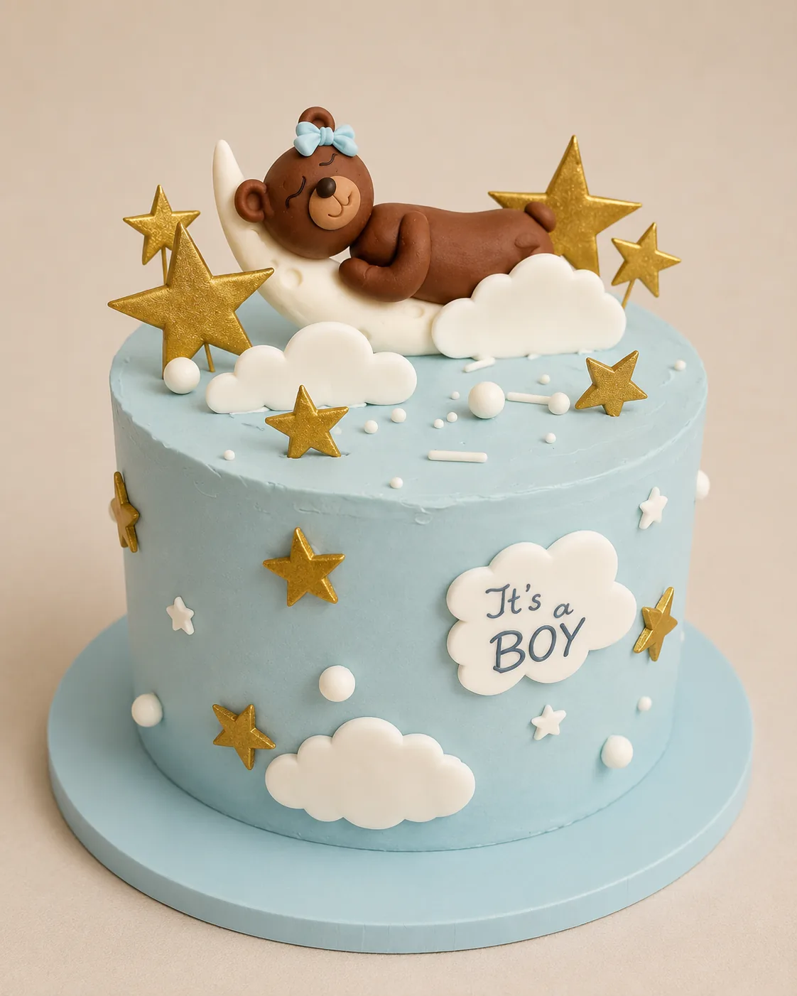 Błękitny tort baby shower z gwiazdami i misiem